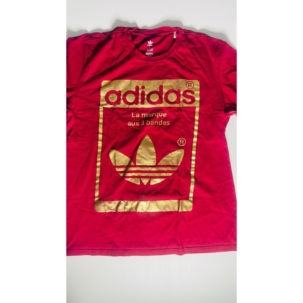 Adidas original burgundy with gold print small short sleeve t-shirt